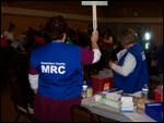 Volunteer Staff Holding Sign