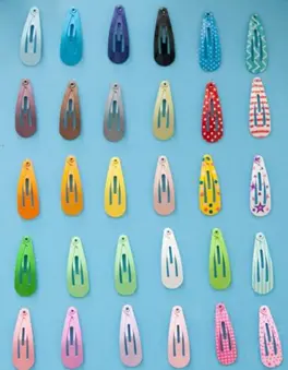 multicolored hair snap fasteners arrayed in a 6x5 grid of all the variations