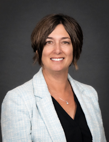 Health Services Agency's managing director, Heather Duvall, smiling warmly and looking at the camera