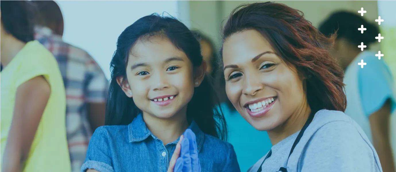 picture of a nurse and a young patient smiling at the camera