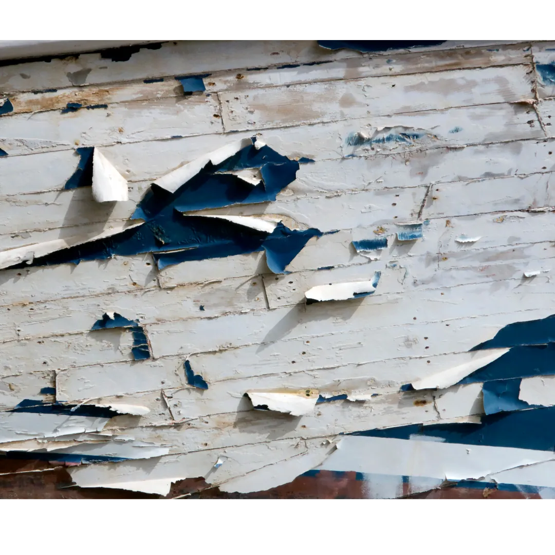 image of chipped paint on the side of a house