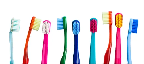 a group of multicolored toothbrushes